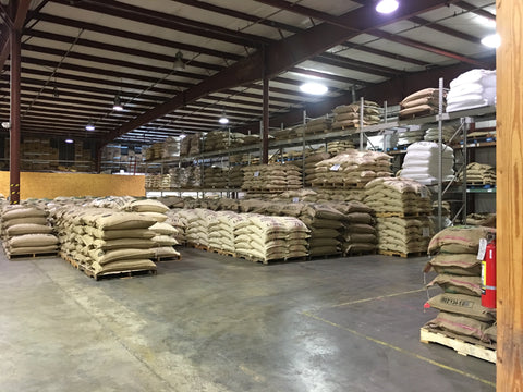 Bags of green coffee inside warehouse