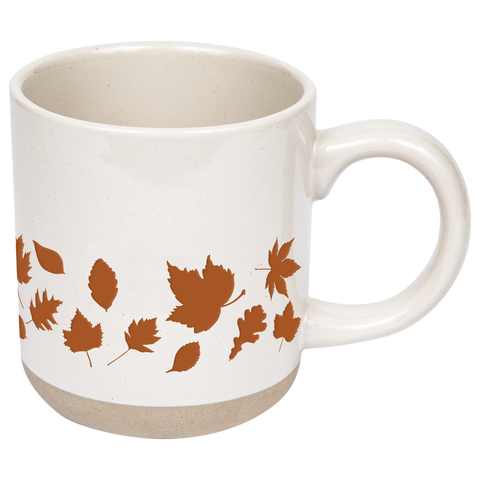 White mug with brown leaf patterns on a white background