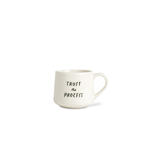 White mug with 'Trust the Process' text on a white background