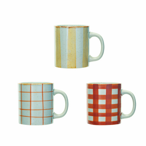Three mugs with different patterns on a white background