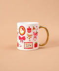 White mug with festive illustrations on a beige background