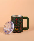 Floral-patterned mug with a clear lid on a beige background