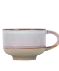 Ceramic mug with a speckled design on a white background