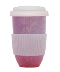 Reusable coffee cup with pink speckled design on a white background