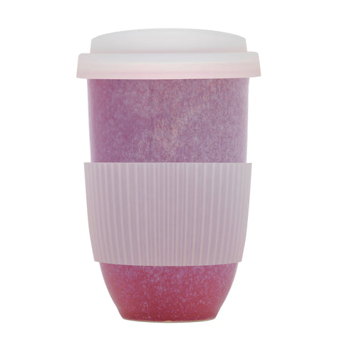 Reusable coffee cup with pink speckled design on a white background