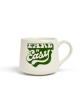 White mug with green text 'Take It Easy' on a white background