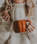 Person holding a ceramic mug with text detailing features and uses.