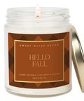 Candle in a jar with 'Hello Fall' label on a white background
