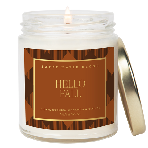 Candle in a jar with 'Hello Fall' label on a white background