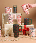 Collection of patterned mugs and tumblers on a beige background with decorative elements.