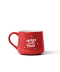 A red ceramic coffee mug with the words 'INSPIRE guide TEACH' in white script and star accents, shown on a clean white background.