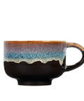 Ceramic mug with gradient glaze on a white background