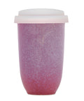 Pink textured tumbler with a white lid on a white background