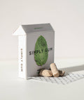Box of Simply Gum with two pieces of gum on a white background