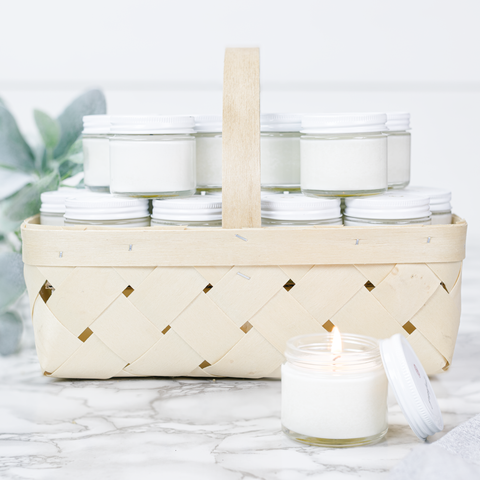 Antique Candle Co.® - Wicker basket filled with white jar candles on a marble surface - Main Street Roasters®