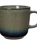 Green ceramic mug on a white background