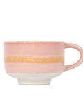 Pink ceramic mug with a yellow stripe on a white background