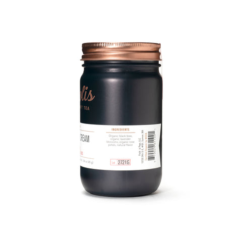 Black jar with a copper lid on a white background