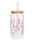 Clear glass tumbler with red candy cane design, wooden lid, and straw on a white background