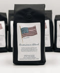 Coffee bags labeled 'Americana Blend' with American flag design on a white background