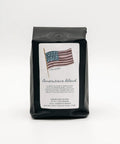 Coffee bag labeled 'Americana Blend' with an American flag on a white background