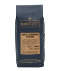 A 16 oz bag of Main Street Roasters Apple Cinnamon Strudel coffee, featuring a dark navy blue bag with a tan label on a white background.