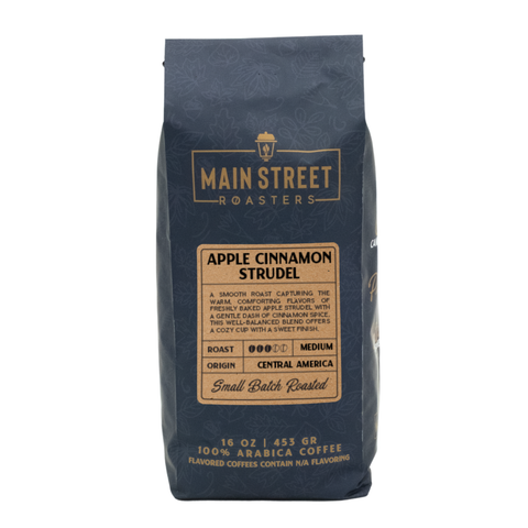 A 16 oz bag of Main Street Roasters Apple Cinnamon Strudel coffee, featuring a dark navy blue bag with a tan label on a white background.
