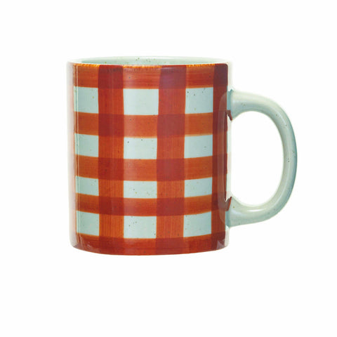 A ceramic mug featuring a red and orange gingham checkered pattern with a light mint green handle and interior, shown against a plain white background.