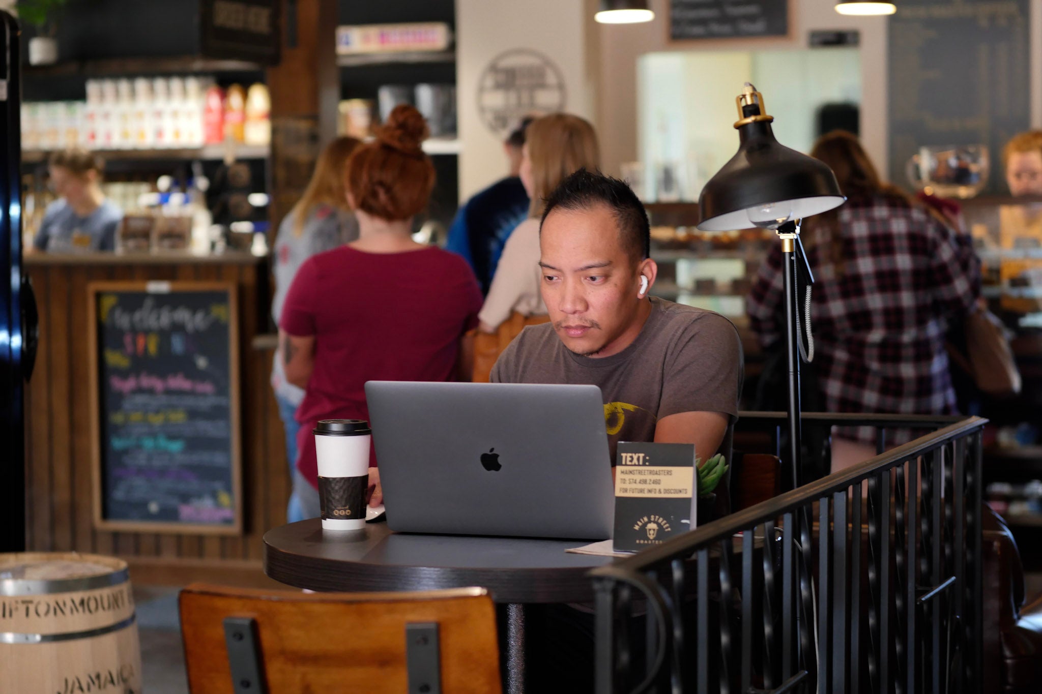 Building Two - Customer Working In Market Street Entrance - Main Street Roasters