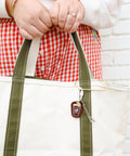 Coffee Charm attached to a white tote bag