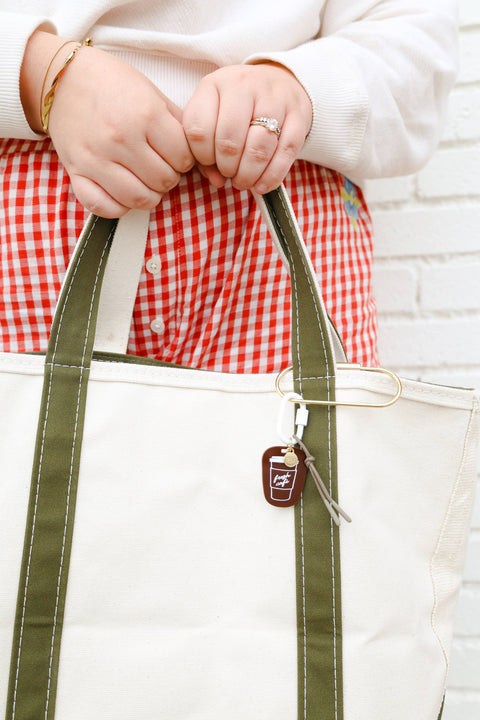 Coffee Charm attached to a white tote bag