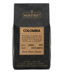 Main Street Roasters Colombia dark roast coffee in black branded bag