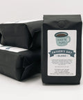 Three black coffee bags with 'Father's Day Blend' labels on a white background