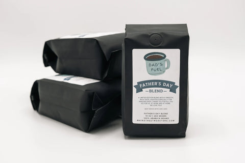 Three black coffee bags with 'Father's Day Blend' labels on a white background