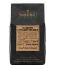 Coffee bag from Main Street Roasters with blueberry cinnamon crumble flavor description.