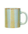 A ceramic mug with a speckled light blue and beige vertical striped pattern, featuring a rustic brown rim and a C-shaped handle, shown on a plain white background.