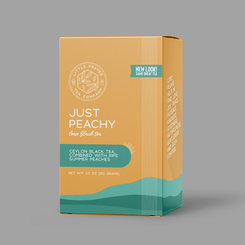 Little Prayer Tea Company Tea box labeled 'Just Peachy' on a gray background