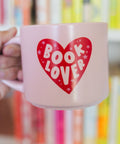 Pink Book Lover Ceramic Mug In Hand