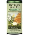 The Republic of Tea Honey Ginseng Green Tea cylindrical tin featuring a green label with honey and ginseng imagery and product branding