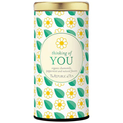 Tea canister with floral design and 'thinking of YOU' text on a white background