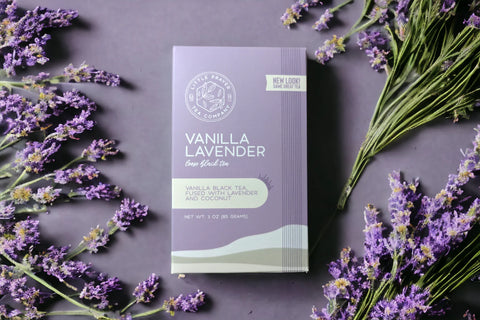 Little Prayer Tea Company Vanilla Lavender tea package with lavender flowers on a dark background