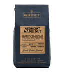 A 10 oz bag of Main Street Roasters Vermont Maple Nut flavored coffee, featuring a dark navy blue bag with a tan label on a white background.