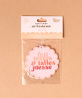 Air freshener packaging with 'fall leaves & lattes please' text on a beige background