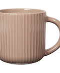 Beige ceramic mug with ribbed texture on a white background