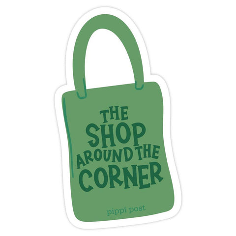 Green bag-shaped sticker with 'The Shop Around the Corner' text on a white background