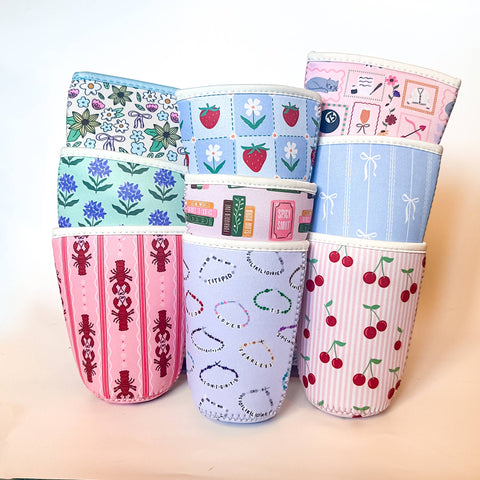 Set of colorful fabric cups with various patterns on a light background