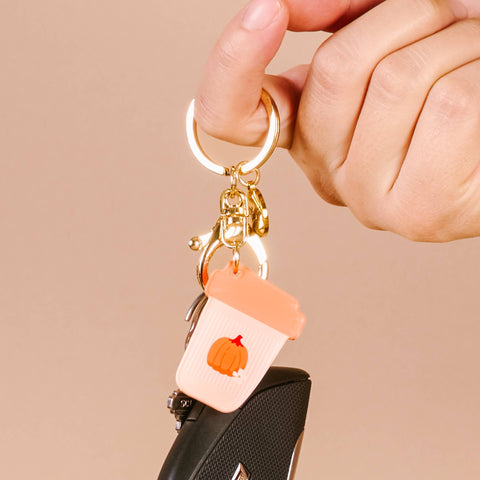 Keychain with a pumpkin design on a beige background
