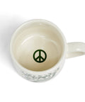 White mug with a peace symbol on a white background