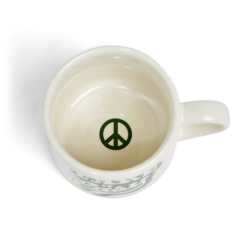 White mug with a peace symbol on a white background