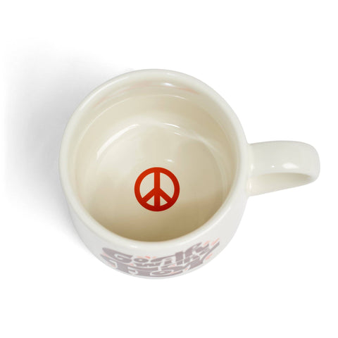 White mug with a red peace symbol on a white background
